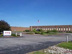 Nhà máy sản xuất trước đây ở Henrietta, New York, được xây dựng vào những năm 1960 và được bán cho Harris RF Communications vào năm 2010.