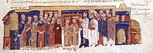 Miniature médiévale représentant le couronnement d'un souverain debout.