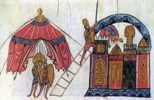 Photographie de la page d'un manuscrit montrant une ville médiévale prise d'assaut.