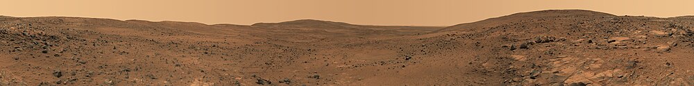 Панорамна гледка в почти реални цветове към повърхността на Марс. Заснета е от марсохода Спирит.