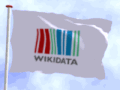 Wikidata logo on a white flag flying in the sky (infinite animation, English)