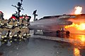 DOD mobile aircraft firefighting training on an aircraft carrier.
