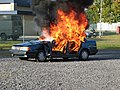 Demonstration by Belgian firefighters - Car wreck doused with gasoline