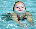 Girl swimming (adaption to water in children)