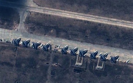Russian SU-27/30 and SU-24 fighter jets sitting on a tarmac at Buturlinovka Air base, 150 km to the Ukainian border